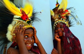 Festival in Dekai, West Papua Young Papuan girlwith bird of paradise headdress