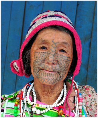 Dulong Valley trekking with Whistling Arrow Drung lady with full facial tattoo, Yunnan, China